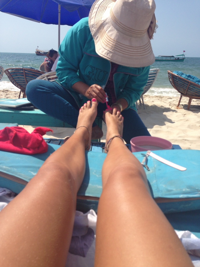 Pedicure on the sand... life's rough